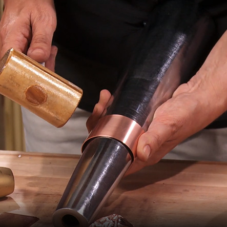 Judy Larson's Why You Should Take a Class - , General Education, , hammering a bracelet onto a mandrel