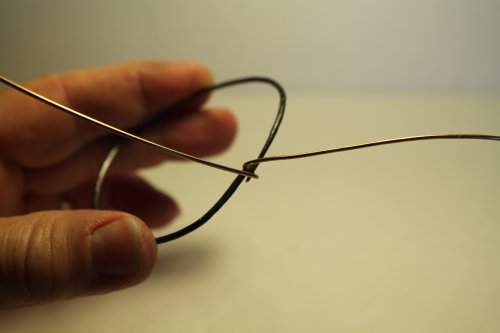 Judy Freyer Thompson's Twisted Wire Hoop Earrings - , Contemporary Wire Jewelry, , Center the wire and make a bend to secure it.    
