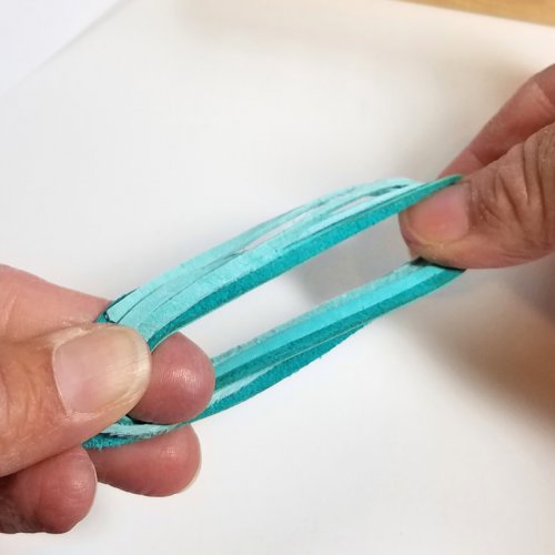 Debbie Blair's Adobe Sun Necklace - , Contemporary Wire Jewelry, Coiling, Coiling Wire, Wire Coiling, Dapping, Dapping Jewelry, How To Punch Holes, Hole Punching, Punch A Hole, Loops, Wire Loop, Wrapped Wire Loop, Beads, Remove the leather from your fingers