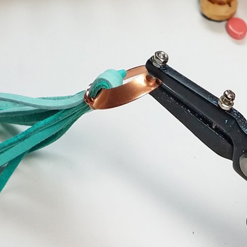 Debbie Blair's Adobe Sun Necklace - , Contemporary Wire Jewelry, Coiling, Coiling Wire, Wire Coiling, Dapping, Dapping Jewelry, How To Punch Holes, Hole Punching, Punch A Hole, Loops, Wire Loop, Wrapped Wire Loop, Beads, Use the hole-punch pliers 