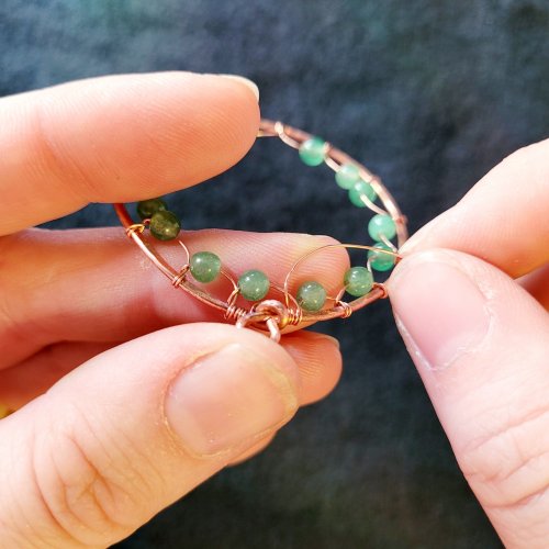 Jennifer Brooks's Dyer's Mushroom Netted Hoop Pendant - , Contemporary Wire Jewelry, Lashing, Wire Lashing, Wire Wrapping, Wrapping, Wire Wrapping Jewelry, , Thread the weaving wire through the last bead-loop and cross over the last bead-loop wire
