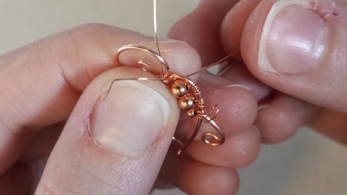 Elizabeth Schultz's Butterfly Swirly Wire Earrings - , Contemporary Wire Jewelry, Coiling, Coiling Wire, Wire Coiling, Lashing, Wire Lashing, Loops, Wire Loop, Wrapped Wire Loop, Wire Wrapping, Wrapping, Wire Wrapping Jewelry,  begin wrapping the 28 gauge wire