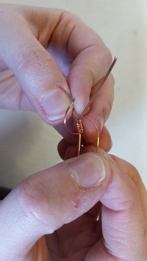 Elizabeth Schultz's Dainty Cabochon Ring - , Contemporary Wire Jewelry, Wire Wrapping, Wrapping, Wire Wrapping Jewelry,  bring it up between the excess wire and the ring band.    