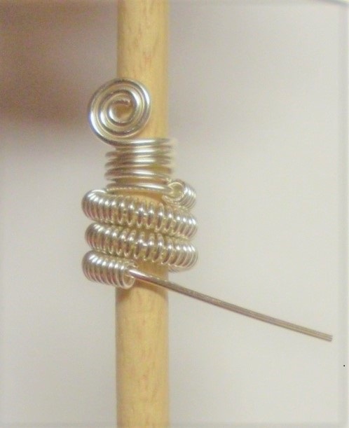 Judy Larson's Coiled Wire End Caps - , Findings & Components, Toggles & Clasps, Earwire & Headpin, Coiling, Coiling Wire, Wire Coiling, Flush cut the 20 gauge wire from the end of the wire coil.