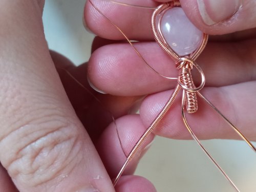 Elizabeth Schultz's Woven Wire Cabochon Pendant - , Wire Weaving, Weaving, Wire Weaving, Weaving Wire, Create a single coil on the middle base wire on the right.