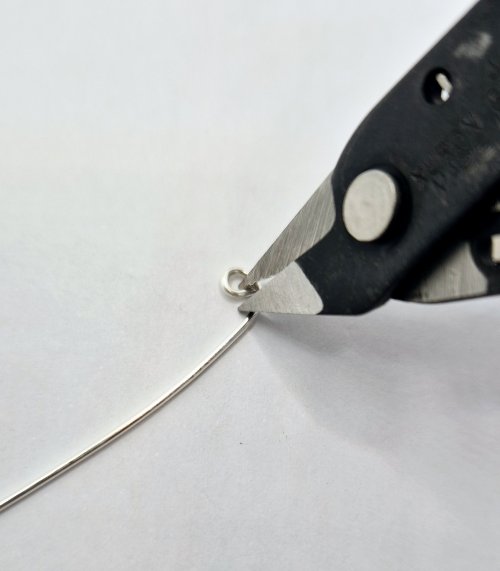 Natalie Patten's Wire Snowmen - , Holiday Designs, Coiling, Coiling Wire, Wire Coiling, Wire Wrapping, Wrapping, Wire Wrapping Jewelry, trim off the tiny straight tip