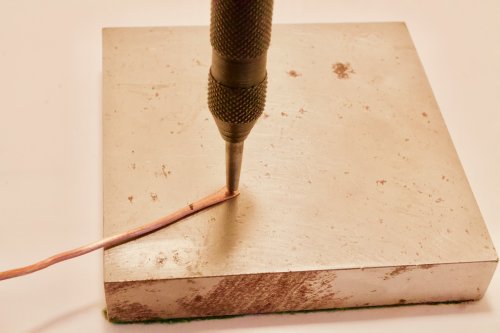 Judy Freyer Thompson's Hinged Neck Wire - , Contemporary Wire Jewelry, Forging, Forging Jewelry, Jewelry Forging, Riveting, Riveting Techniques, Wire Rivets, Rest the wire on the steel bench block 