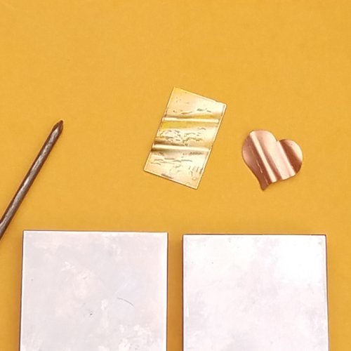 Debbie Blair's Adding Creases to a Metal Blank - , Metalwork, Tools, use steel wool or a buffing block to highlight 