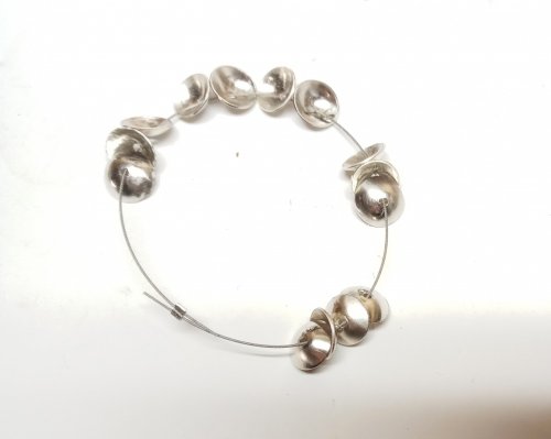 Judy Larson's Bead Cap Primer - Finishing:, Wire Jewelry Design, Dapping, Dapping Jewelry, Filing, Finishing, How To Punch Holes, Hole Punching, Punch A Hole, Throw the unit into the tumbler