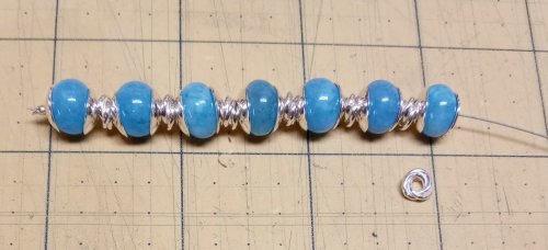 Judy Larson's Bead Cap Primer - What bead caps can do for my rondelle beads:, Wire Jewelry Design, Dapping, Dapping Jewelry, Filing, Finishing, How To Punch Holes, Hole Punching, Punch A Hole, Adding bead caps to each of the seven beads