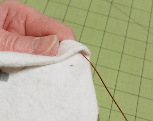 Judy Larson's Simple Way to Straighten Wire - , General Education, , Fold the flannel square in half to provide