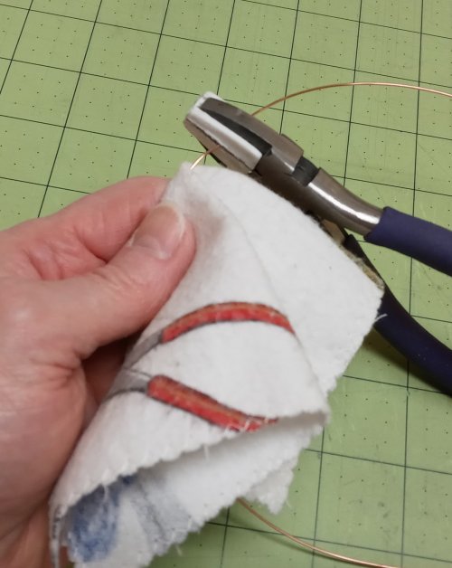 Judy Larson's Simple Way to Straighten Wire - , General Education, , fold the folded flannel piece over the center of the wire