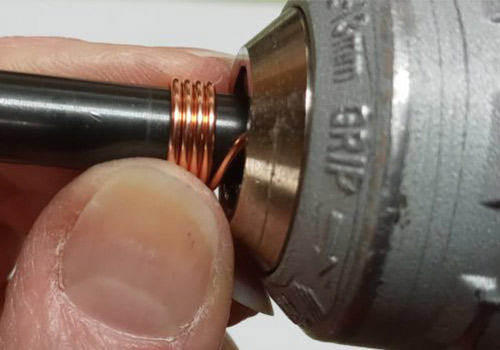 Judy Larson's Coiling Wire for Jump Rings - , General Education, Jump Rings, Jump Ring, Making Jump Rings, turn mandrel and wrap the wire around it
