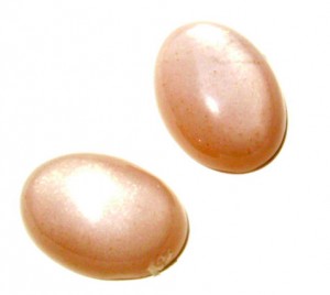 A pair of calibrated peach-tone moonstone cabochons. Private collection, Dale Armstrong.