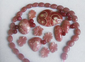 Rhodochrosite beads, cabs, and carvings