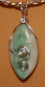 Batya Morris wire wrapped this emerald in matrix bead into a reversible pendant.