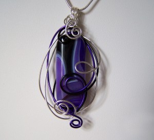 Colorful Swirls, a purple agate wire sculpted pendant by Linda Gyetvay