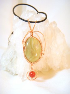 Borrowing from the Fall 2012 Pantone color palette, Terri McMahon created this chartreuse and tangerine wire wrapped pendant.