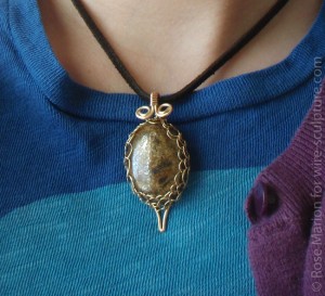 Wire wrapped bronzite pendant by Rose Marion, wrapped in bronze wire.