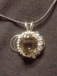 Wire wrapped topaz pendant by Cindy Massey