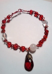 Brenda Sigafoos created this wire and garnet piece with matching red wire.