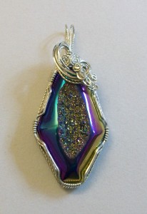 Titanium druzy wrapped by Joan Madouse