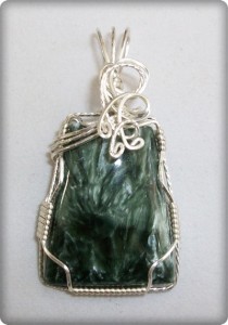 Joan Madouse wire wrapped this seraphinite pendant in silver-plated wire.