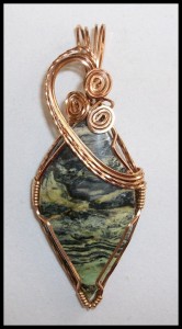 Joan Madouse wrapped this serpentine stone in bronze wire.